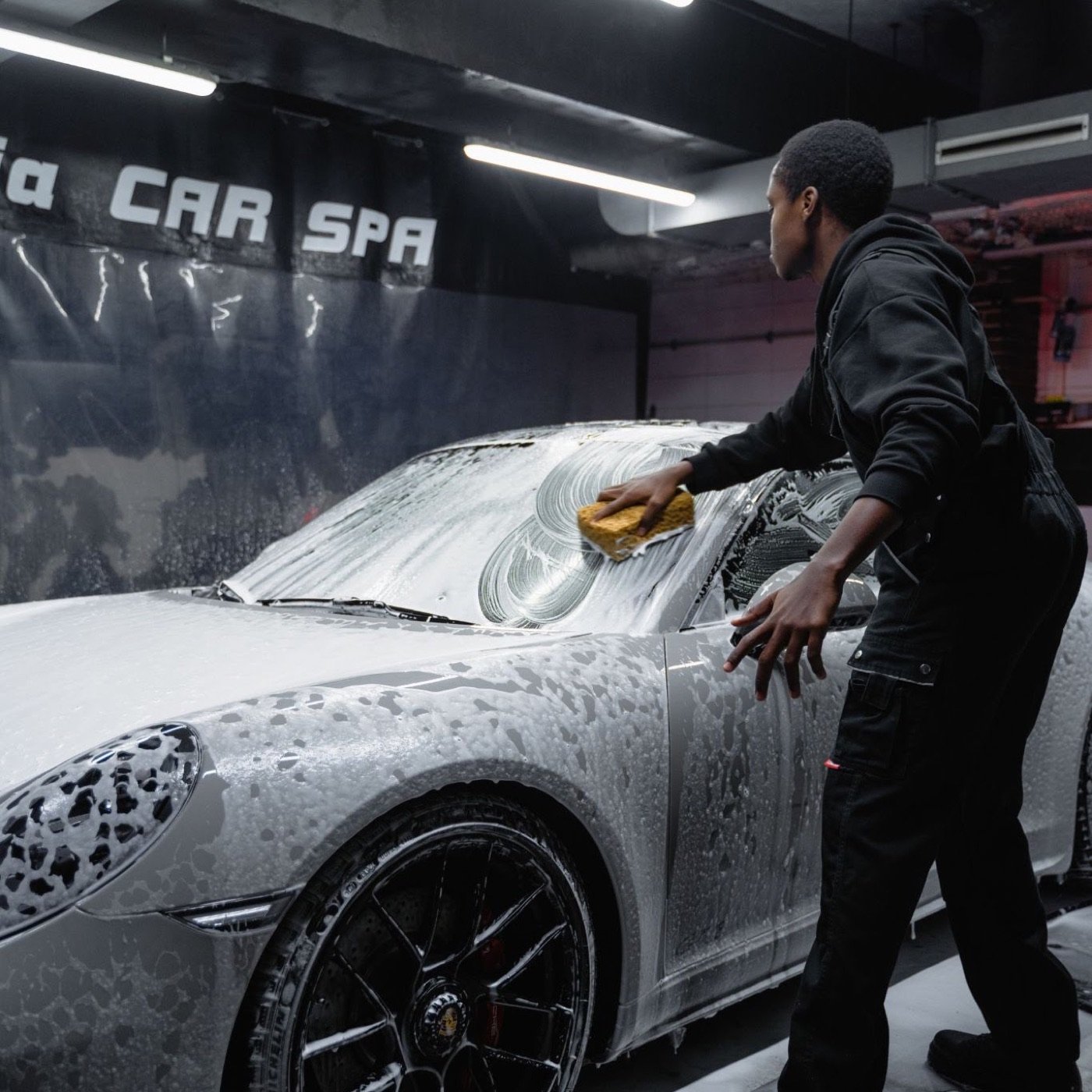 Sponge wash along the side of a car